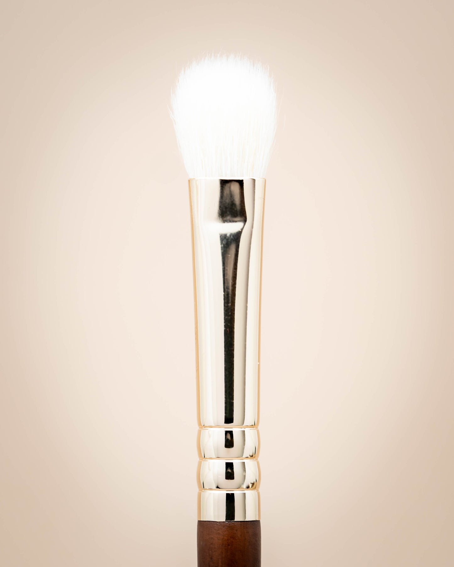 This is a detailed natural haired eyeshadow blending brush with a wooden handle.