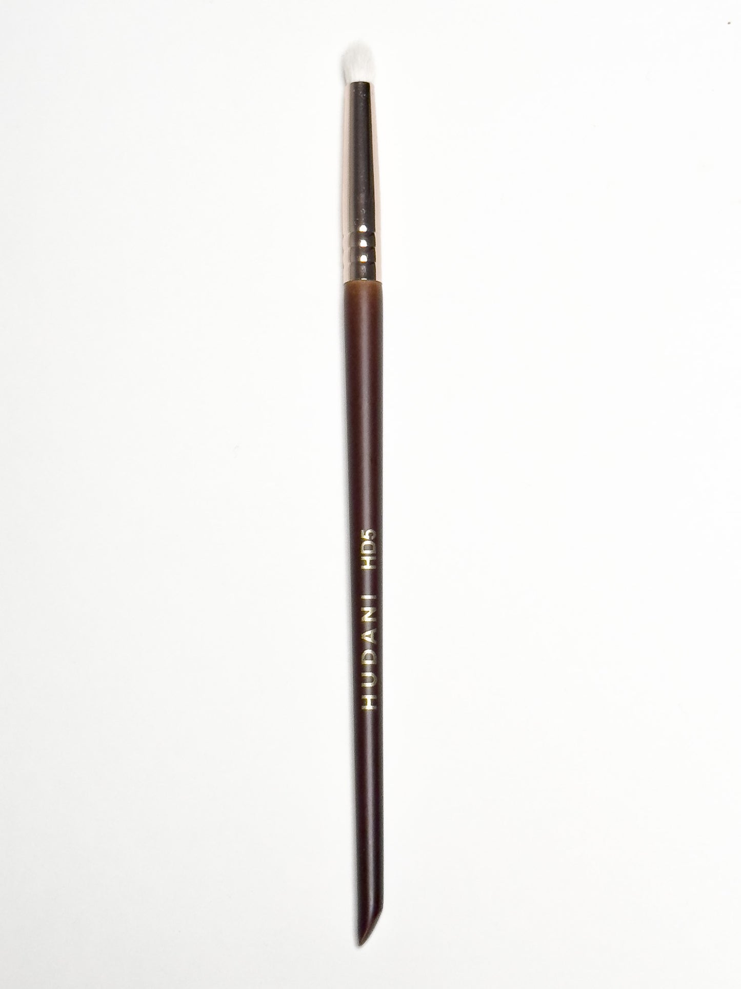 This is a Natural haired pencil brush and it has a wooden handle.