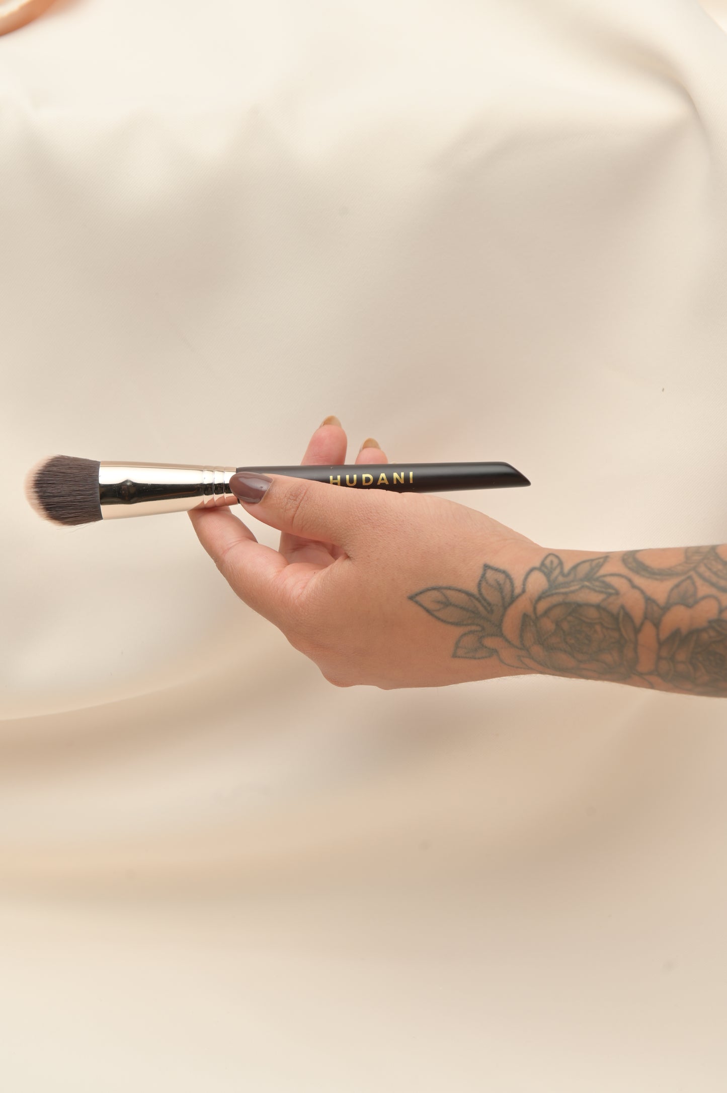 This is a duo fiber angled foundation brush and it has a wooden handle.