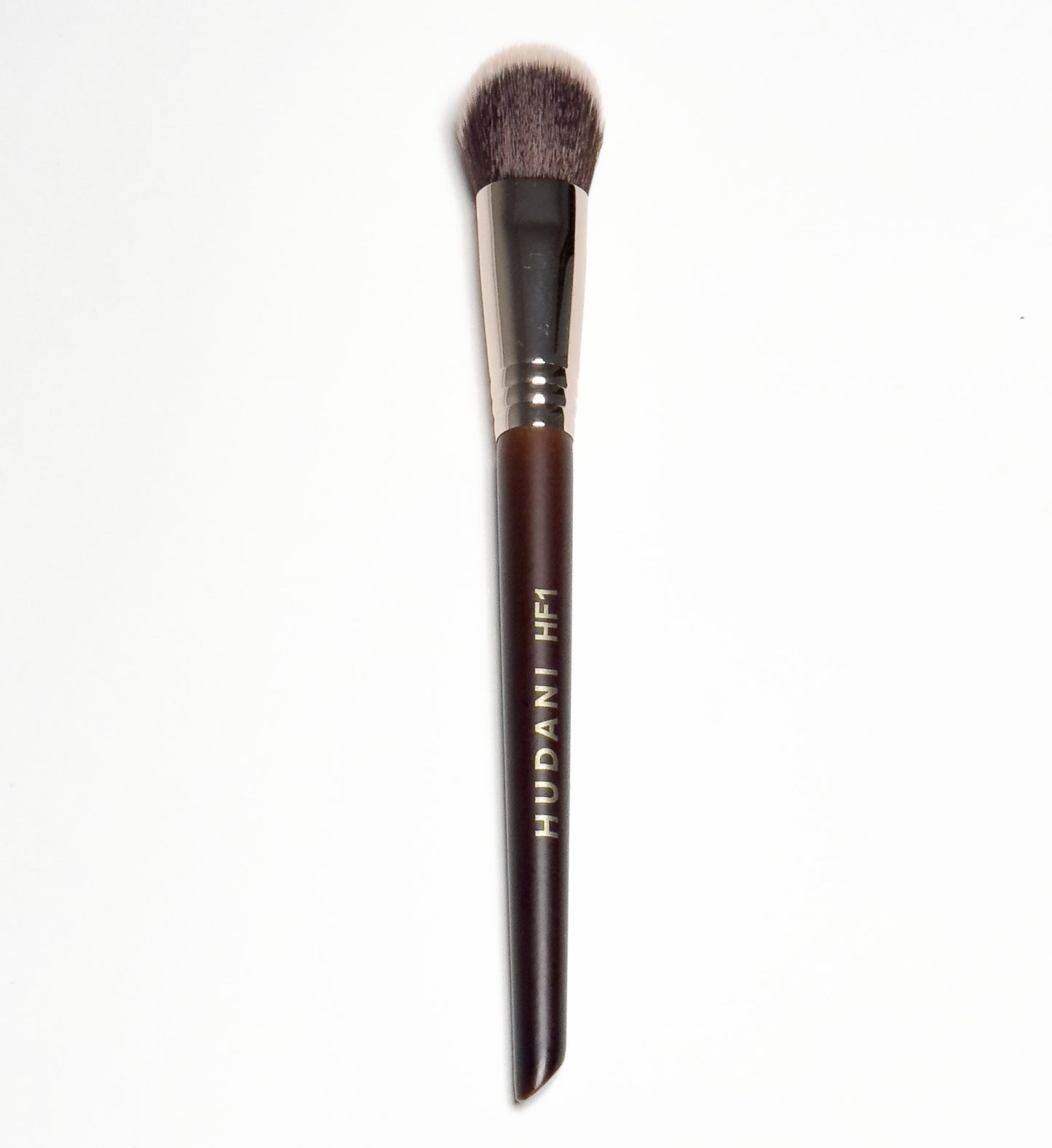 This is a duo fiber angled foundation brush and it has a wooden handle.