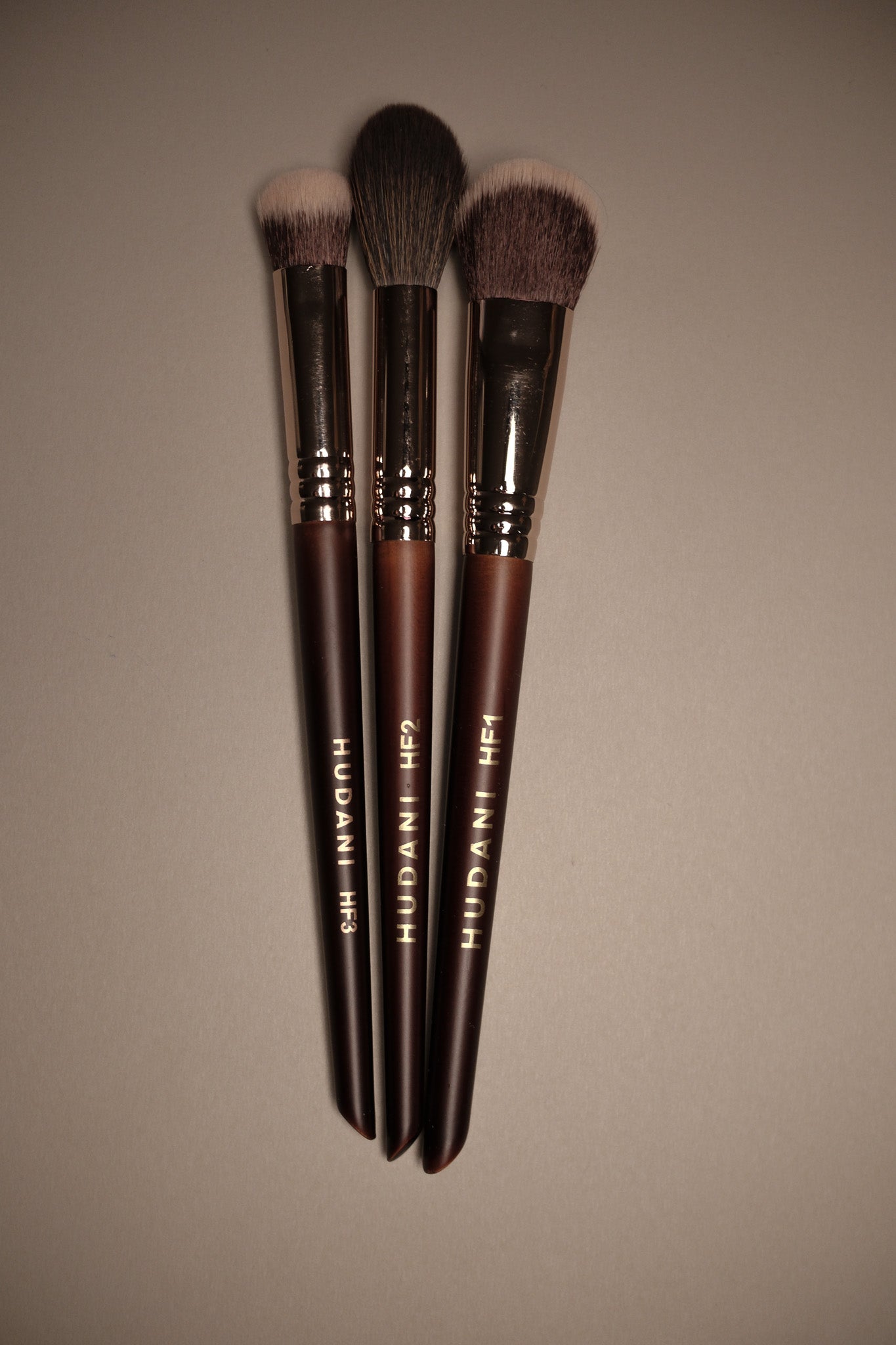 This is a duo fiber angled concealer brush and it has a wooden handle.